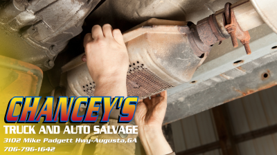 SALVAGE WITH CHANCEYS A SET OF HANDS PULLS A USED PART FROM A SALVAGE VEHICLE